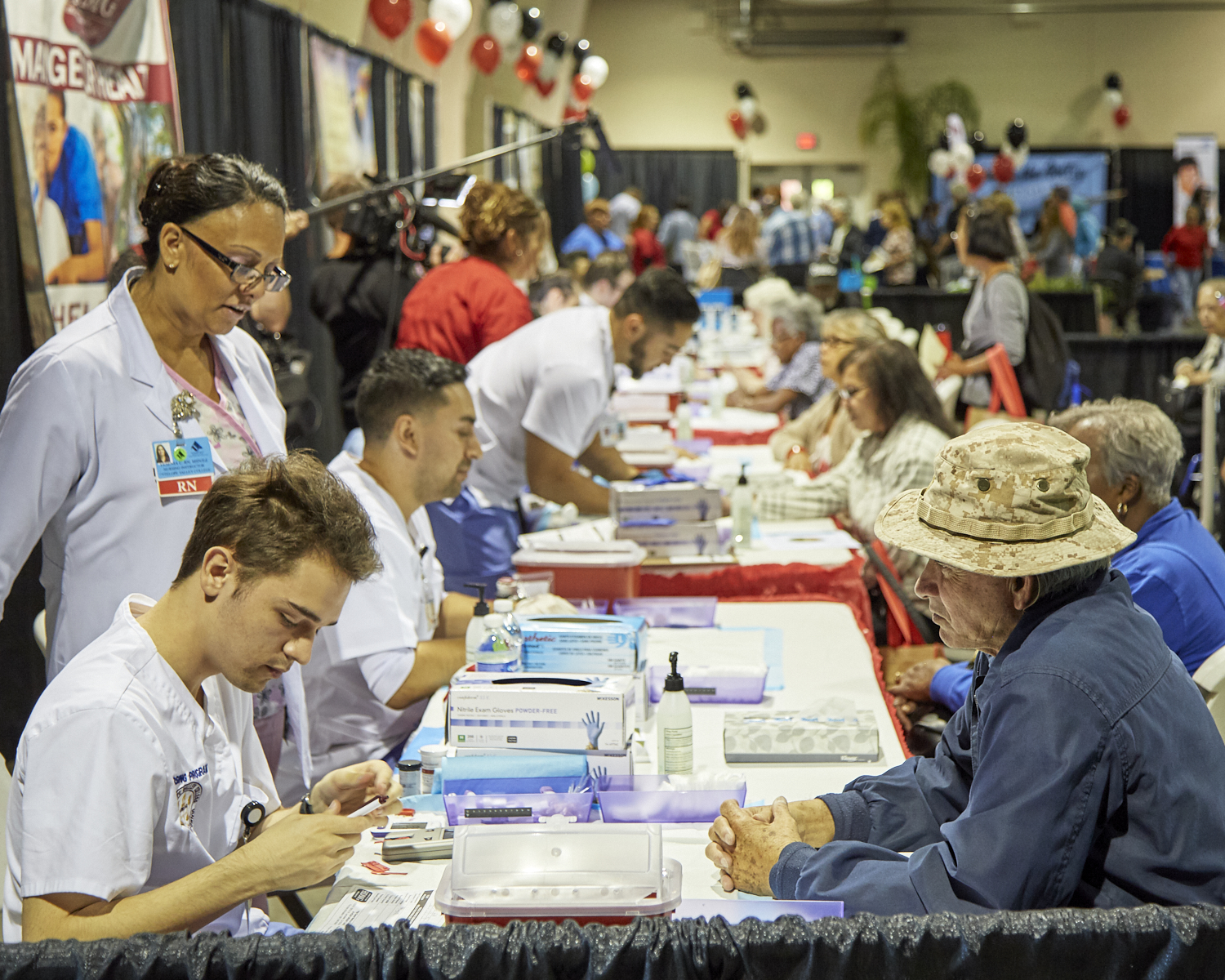 Attendees receiving their health screenings