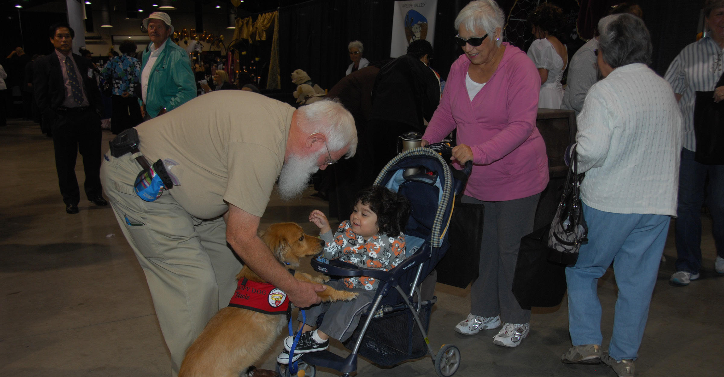 Seniors with dog and baby