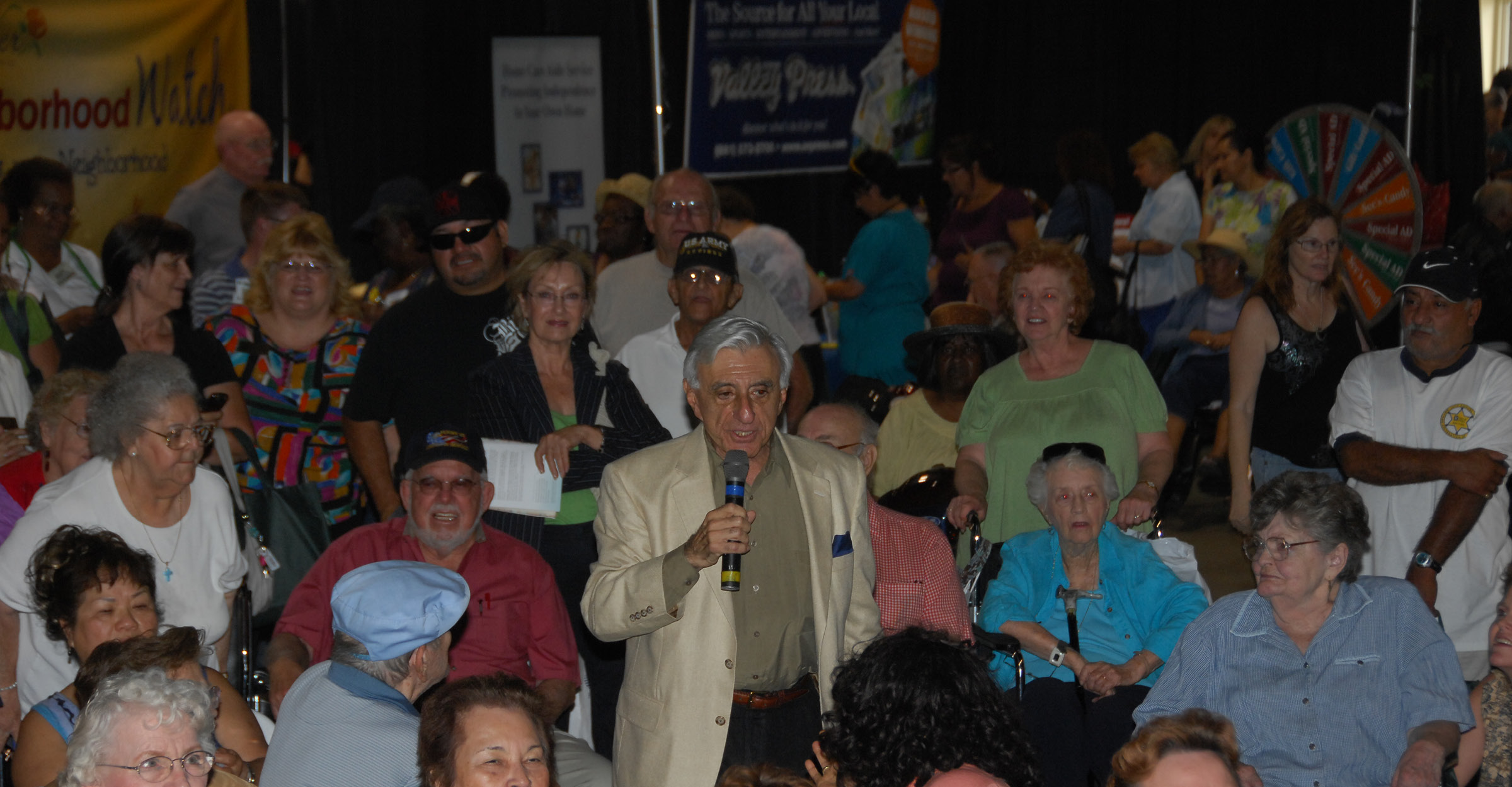 Jamie Farr standing in crowd