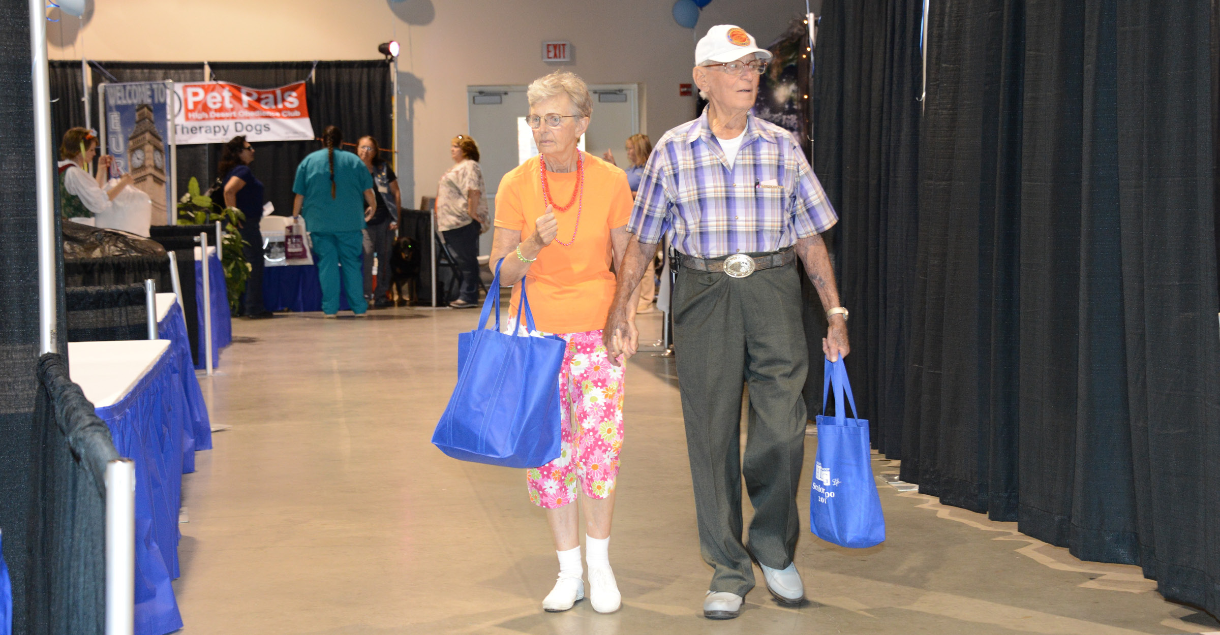 Senior couple holding hands