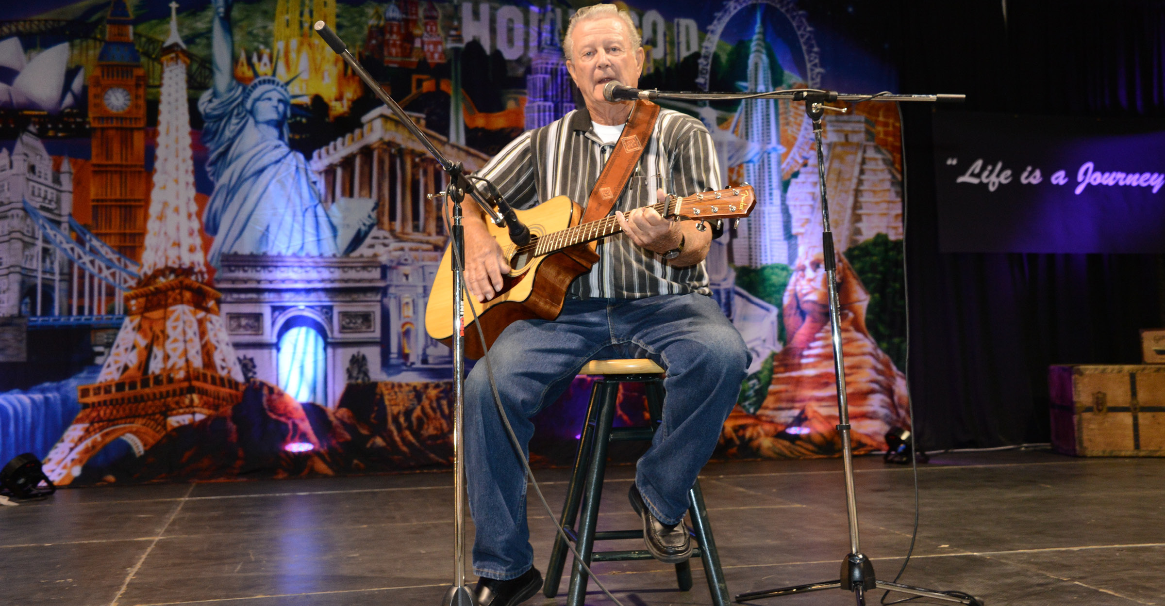 Senior playing guitar