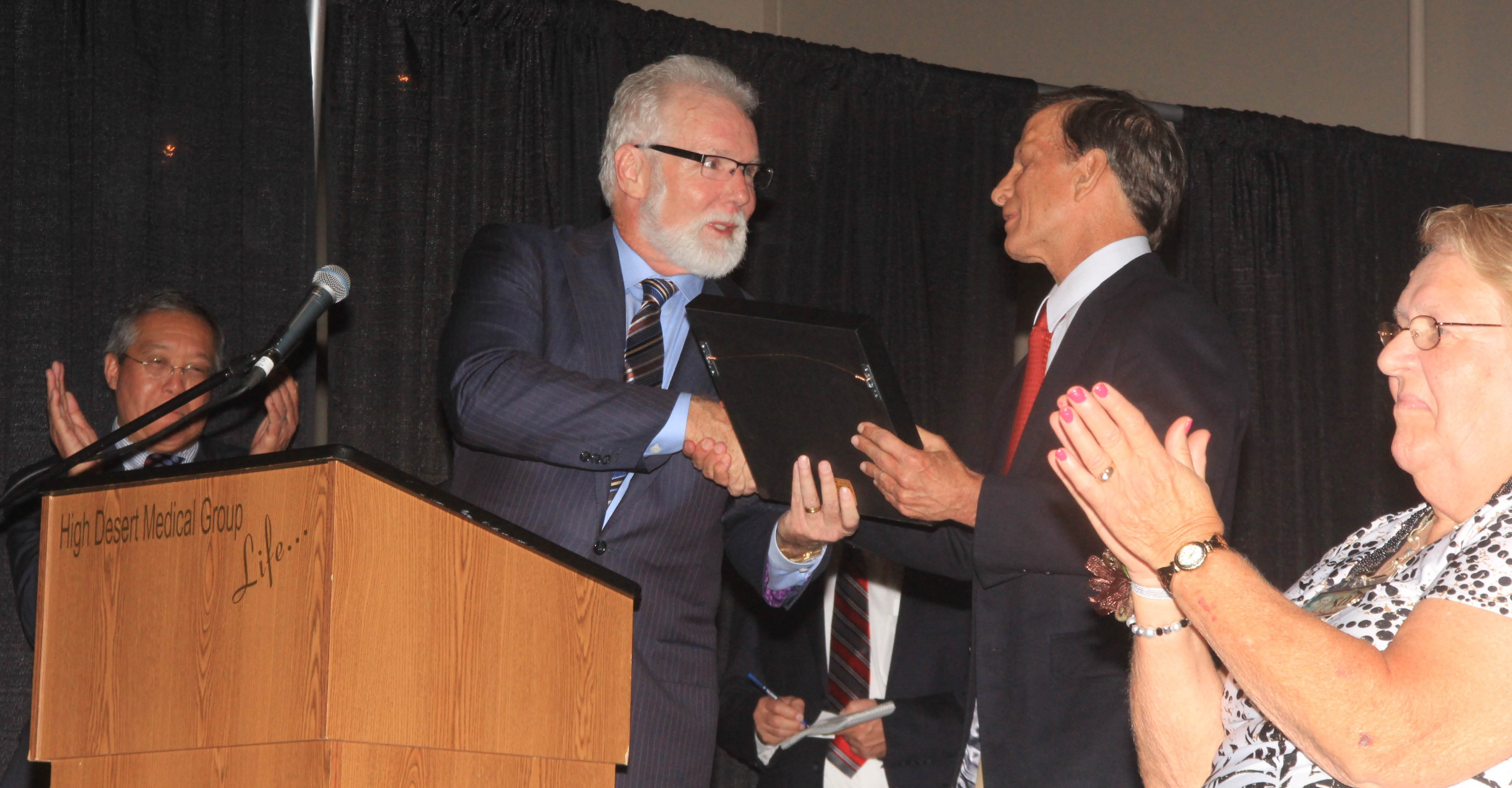 Mayor Rex Parris gives Dr. Merkin key to the City